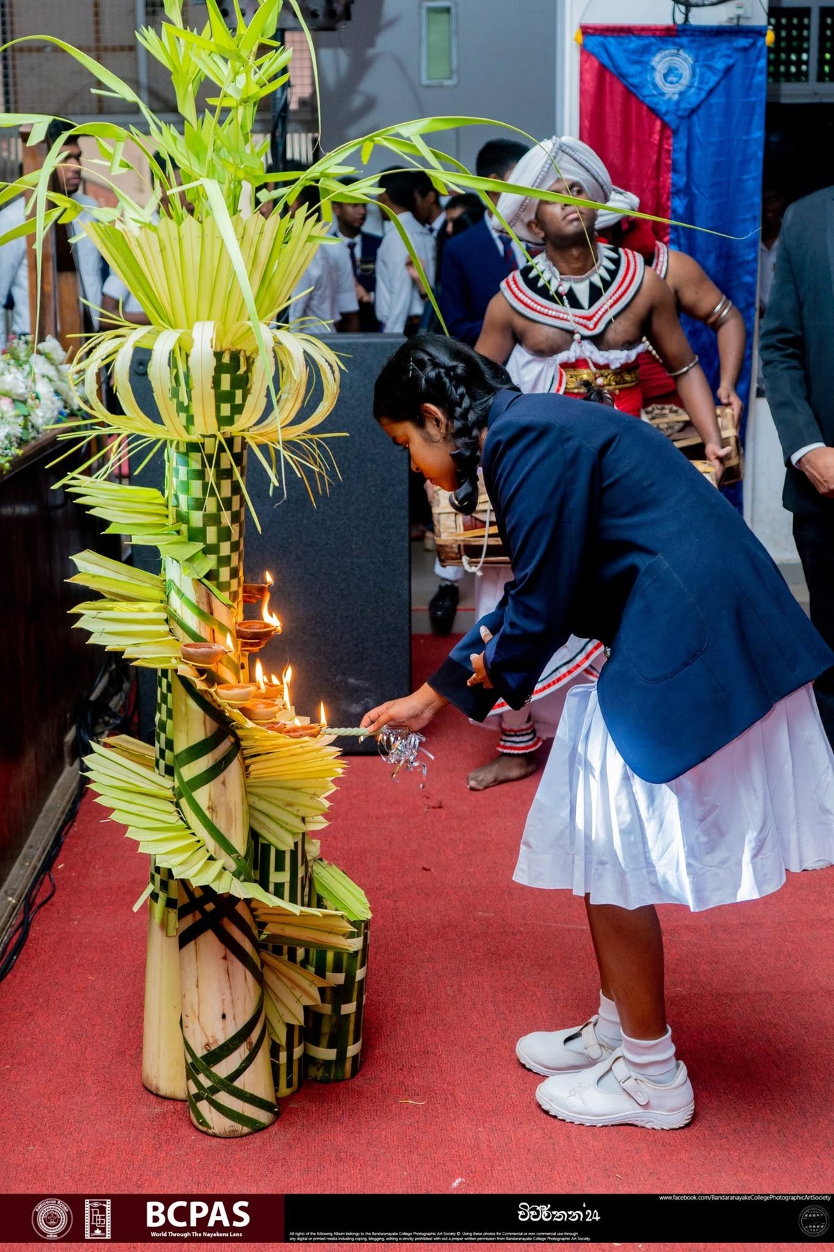 Lamp lighting by a student — Vivarthana 2024